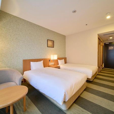 Hotel Granvia Wakayama Exteriör bild A room at the hotel